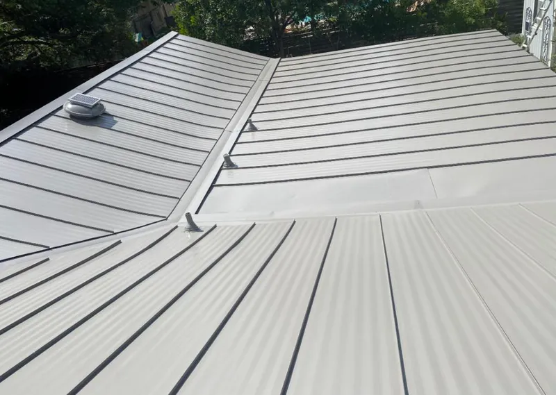 Solar attic fan installed on a metal roof for Roof Ventilation in Mount Hope